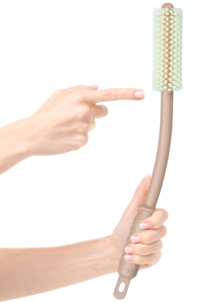 Tan Booty Brush with a long curved handle and brush head