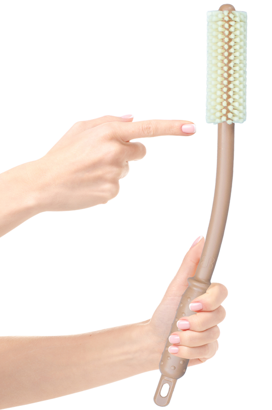 Tan Booty Brush with a long curved handle and brush head